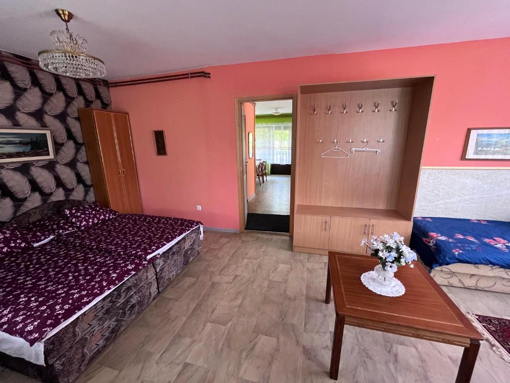 Postel nebo postele na pokoji v ubytování Nap körút Apartman