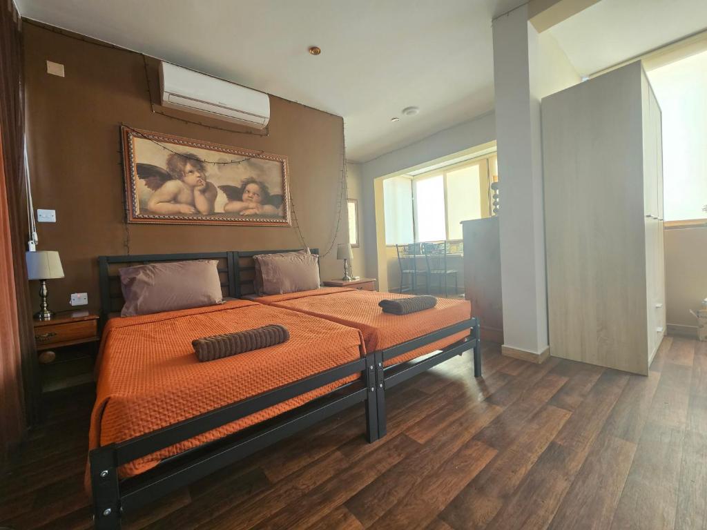Postel nebo postele na pokoji v ubytování Lotus Guest House Malta