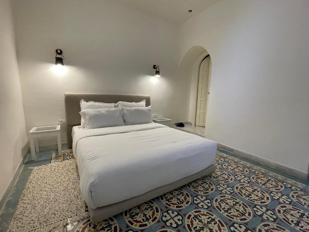 Voodi või voodid majutusasutuse Dar Kbira - Sidi Bou Said toas
