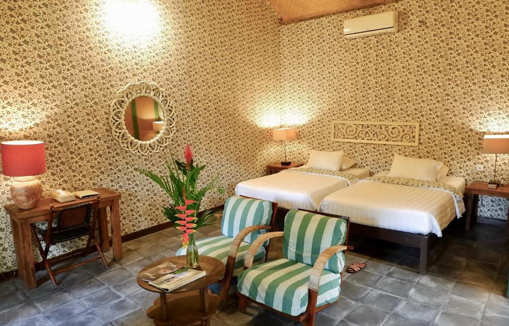 Letto o letti in una camera di D'omah Yogya Hotel