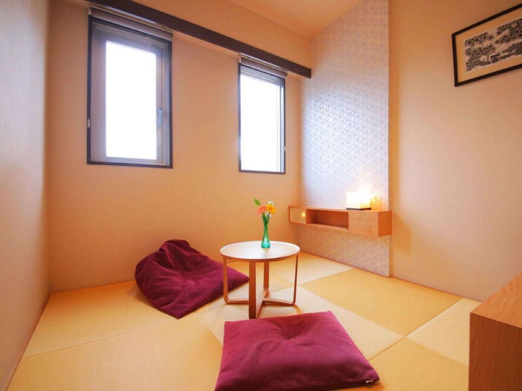 Postel nebo postele na pokoji v ubytování Hotel Claire Higasa