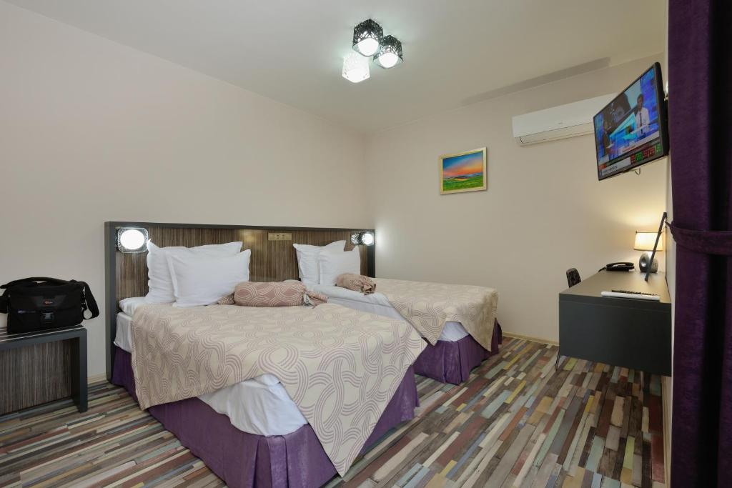 Postel nebo postele na pokoji v ubytování Hotel Hello Hissar