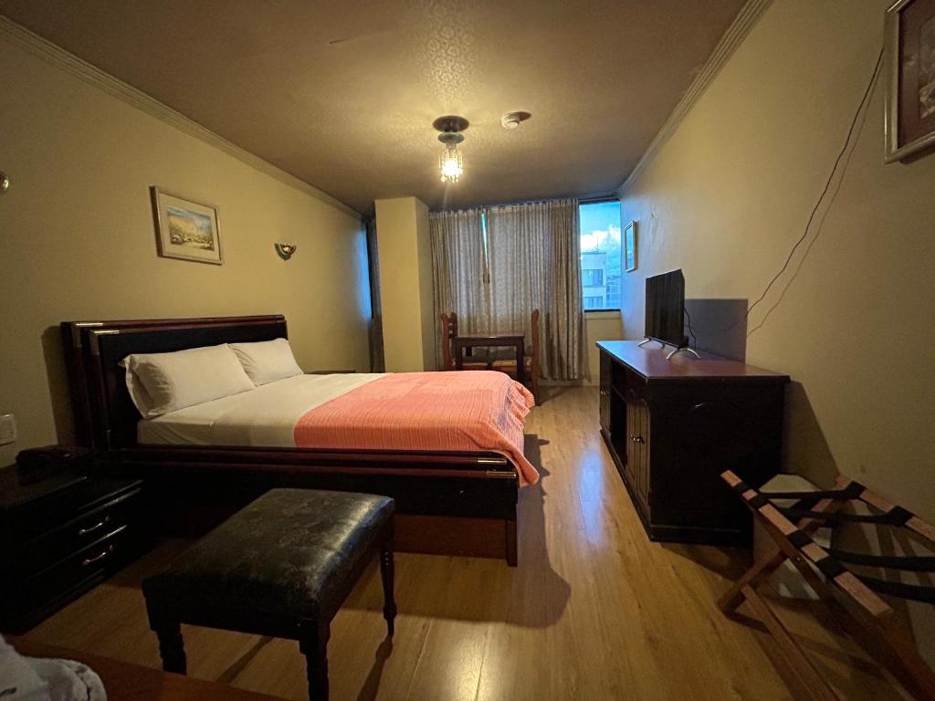 Postel nebo postele na pokoji v ubytování IÑAQUITO GOLD hostal