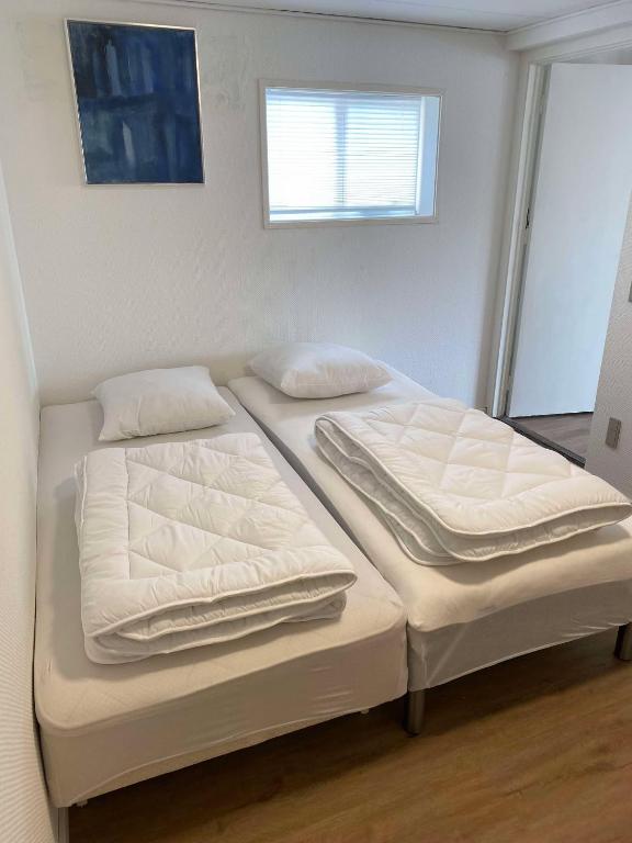 Postel nebo postele na pokoji v ubytování Havnekrogen