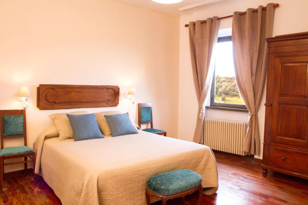 Ένα ή περισσότερα κρεβάτια σε δωμάτιο στο Agriturismo Borgo dei Ricci