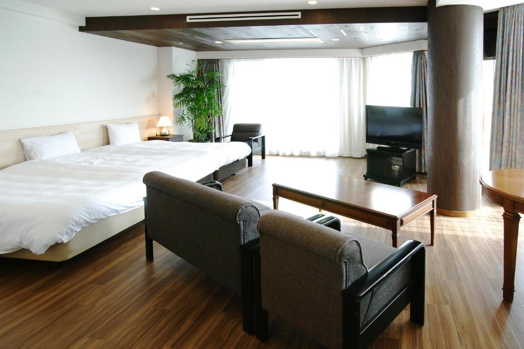 Postel nebo postele na pokoji v ubytování Izumigo AMBIENT Izu-Kogen Condominium