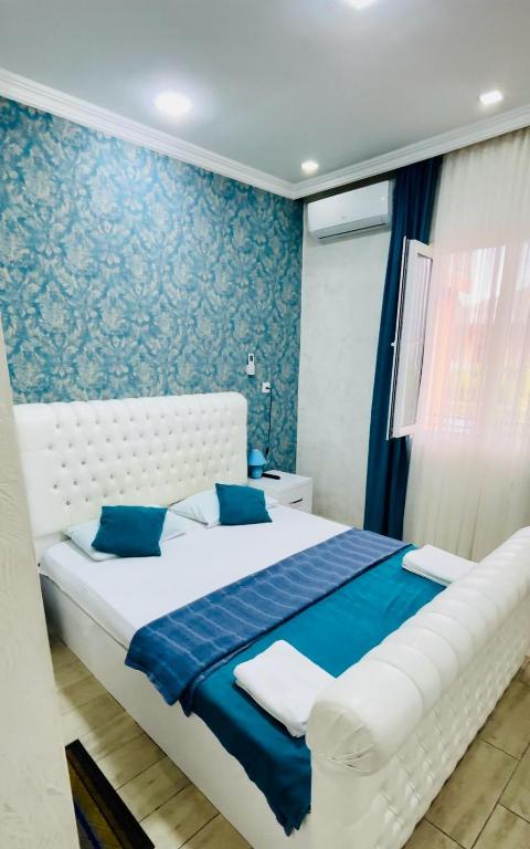 Postel nebo postele na pokoji v ubytování Nikas Guest House
