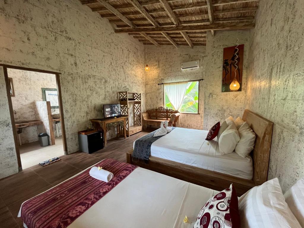 Postel nebo postele na pokoji v ubytování D'Nanda mini hotel Ubud