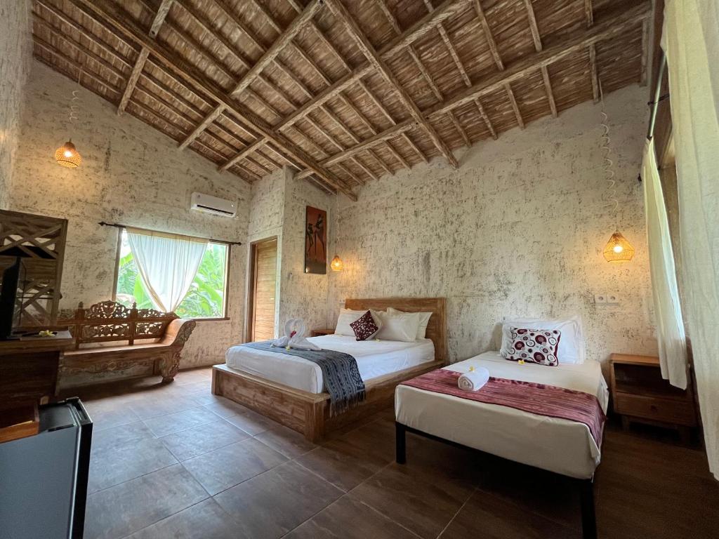 Postel nebo postele na pokoji v ubytování D'Nanda mini hotel Ubud
