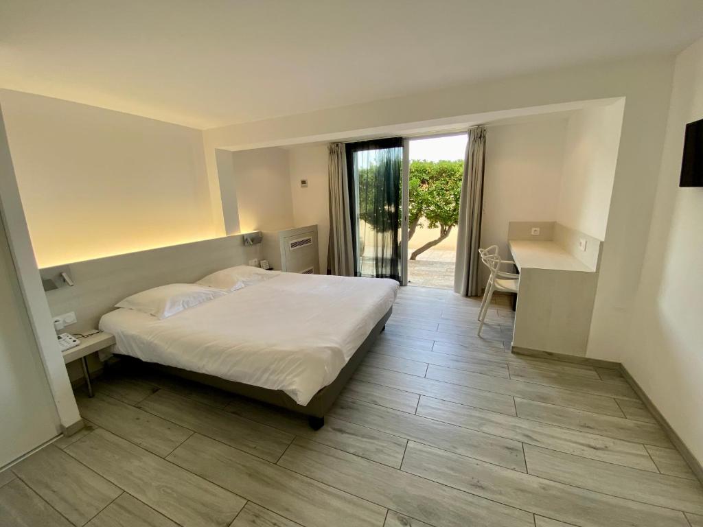 Postel nebo postele na pokoji v ubytování Hotel L'ondine