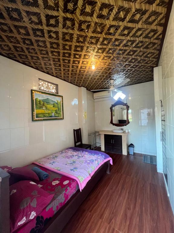 Postel nebo postele na pokoji v ubytování Banana Home Stay Ubud