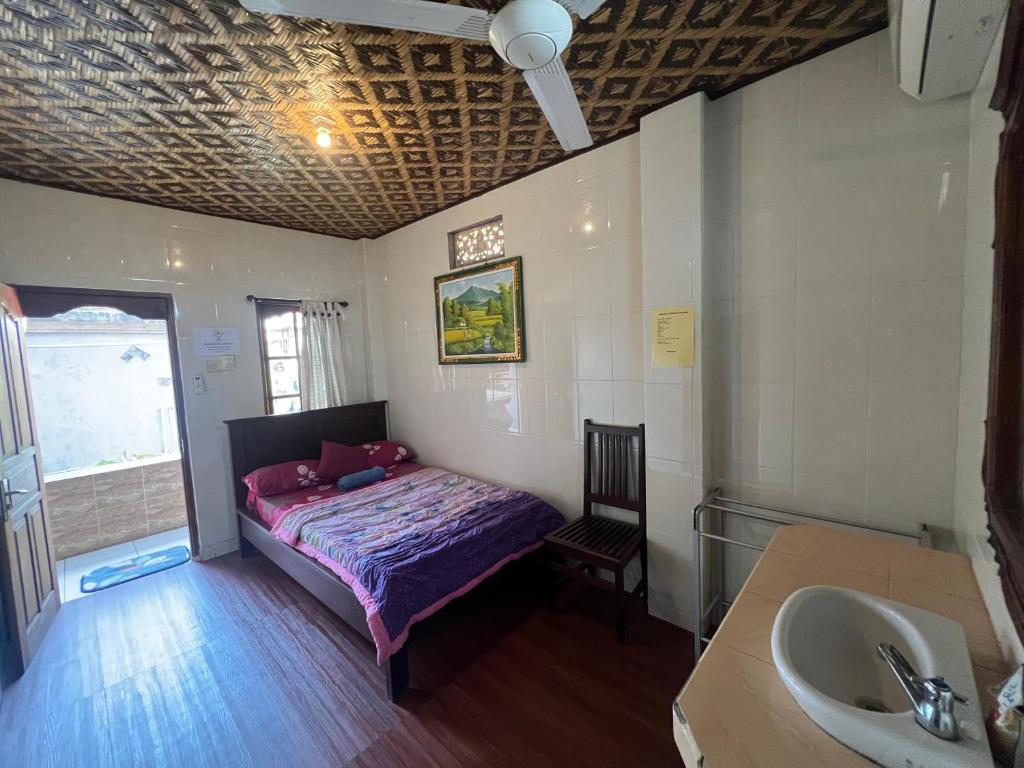 Postel nebo postele na pokoji v ubytování Banana Home Stay Ubud