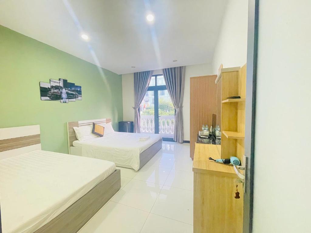 Postel nebo postele na pokoji v ubytování Mila Homestay Grand World Phú Quốc
