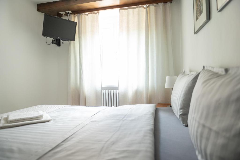 Postel nebo postele na pokoji v ubytování Locanda Poncini