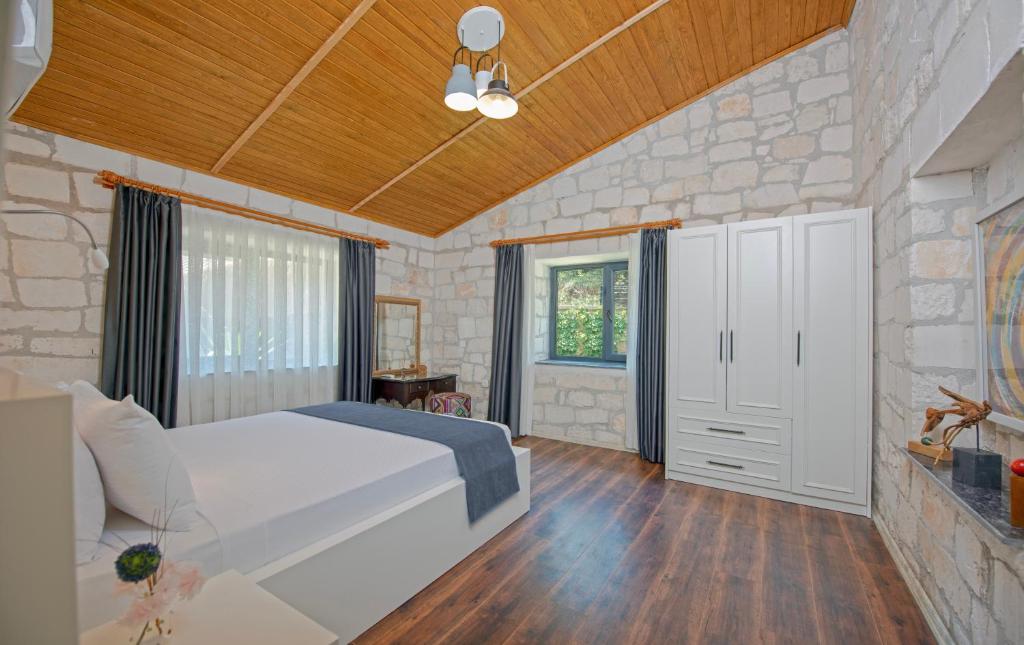Postel nebo postele na pokoji v ubytování Yusalis Garden Hotel