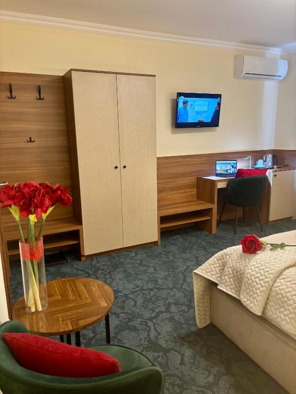 Postel nebo postele na pokoji v ubytování Hotel Garni Expo