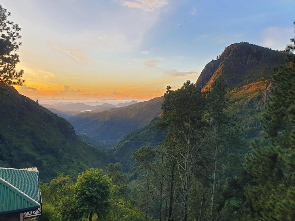 a view of a valley in the mountains at sunset at Ella Mount Relax Cottage in Ella