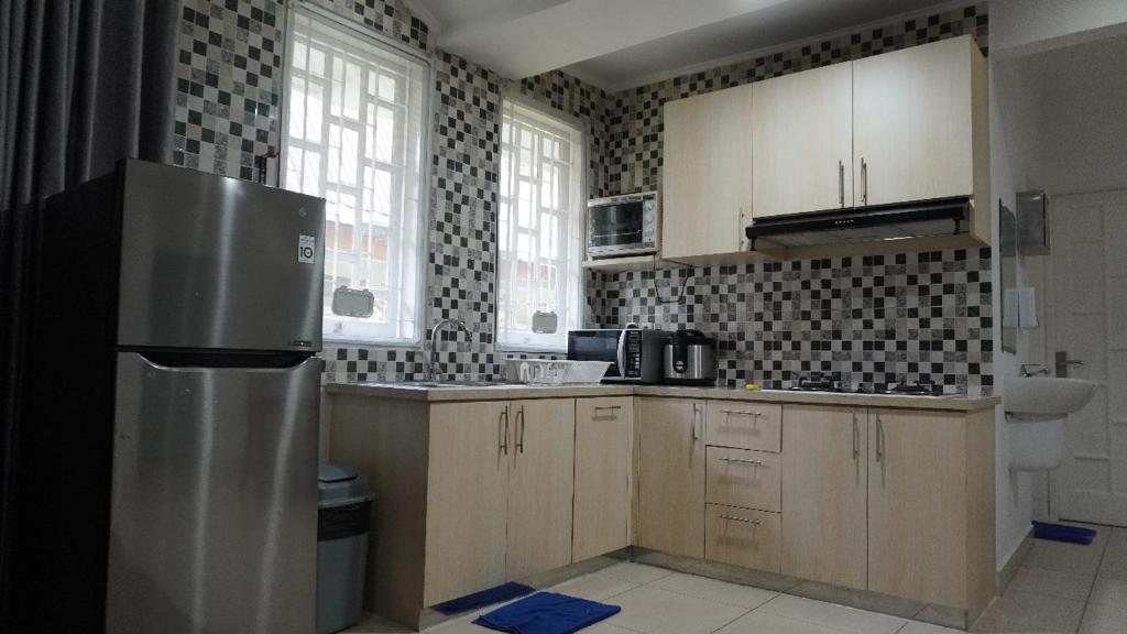 Kuchyň nebo kuchyňský kout v ubytování Diyar Villas Puncak M6-11