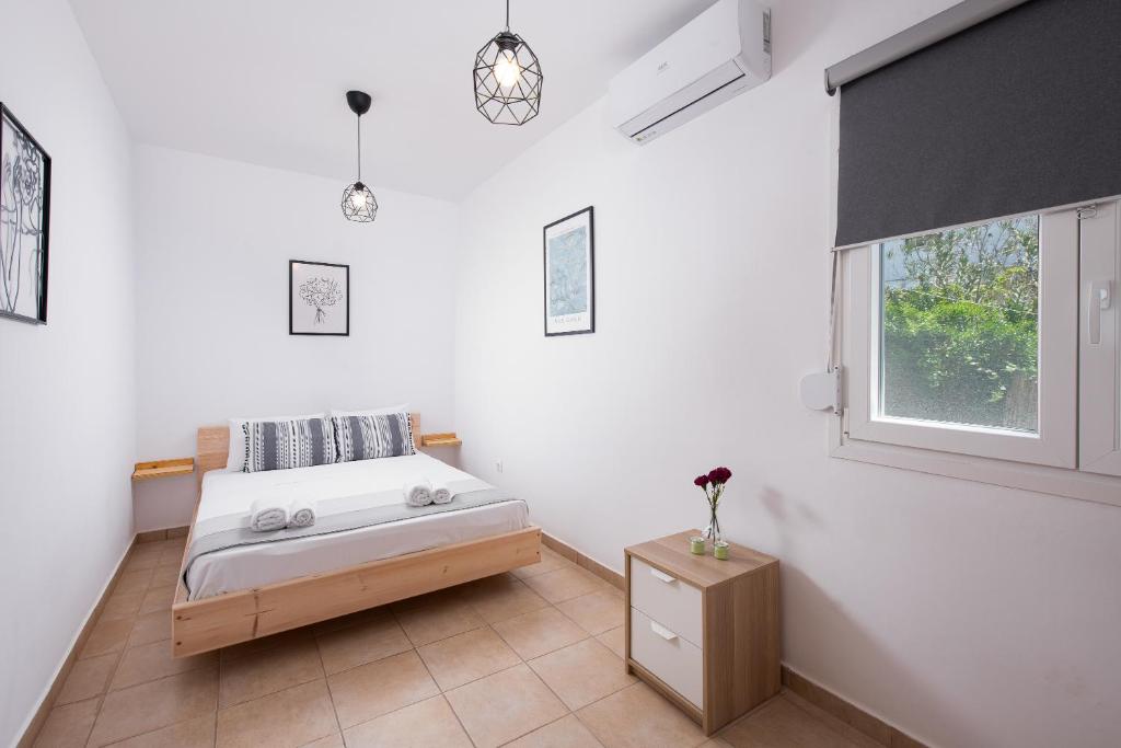Postel nebo postele na pokoji v ubytování Rafaelo Pool Side Villas