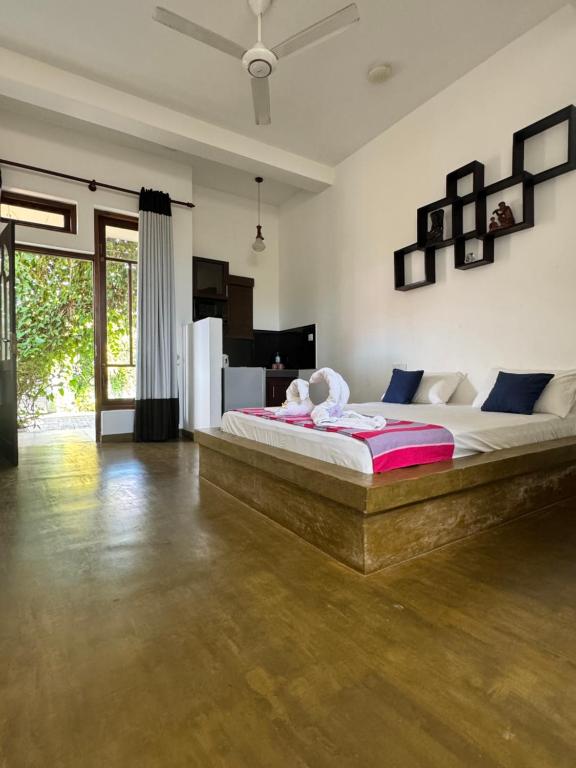 Postel nebo postele na pokoji v ubytování Royal Breeze Negombo