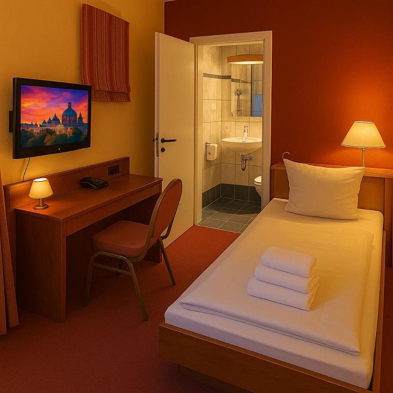 Postel nebo postele na pokoji v ubytování Hotel Schwarzenbek