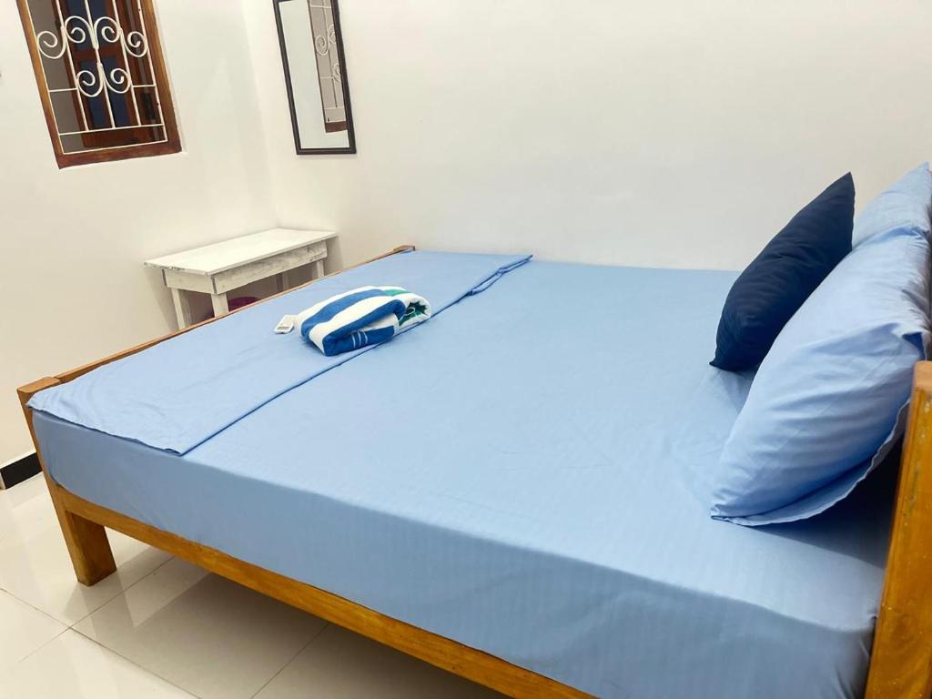 Postel nebo postele na pokoji v ubytování Trinco Sailu Inn
