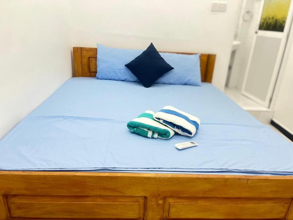 Postel nebo postele na pokoji v ubytování Trinco Sailu Inn