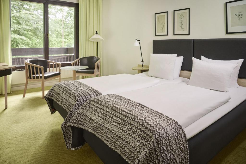 Postel nebo postele na pokoji v ubytování Munkebjerg Hotel