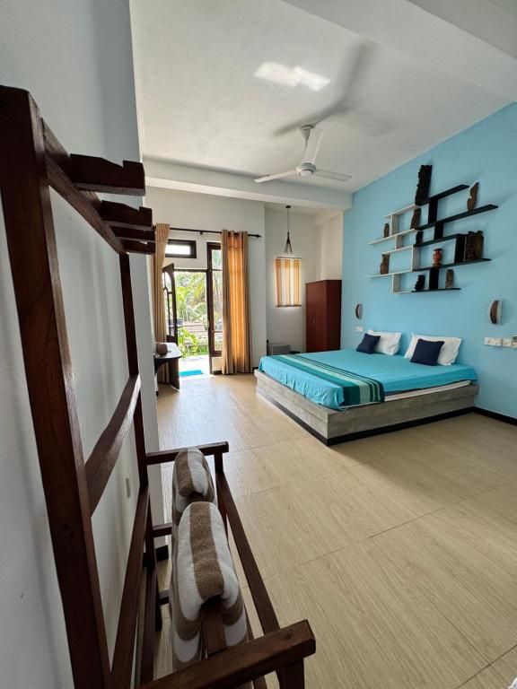 Postel nebo postele na pokoji v ubytování Royal Breeze Negombo