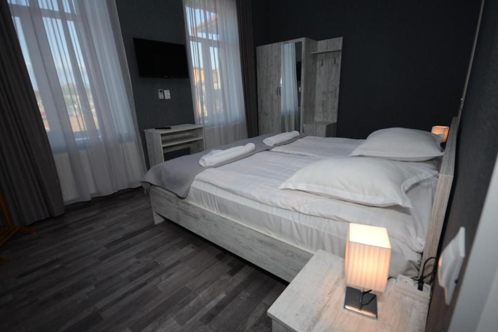 Postel nebo postele na pokoji v ubytování Hotel Terrace Rabath