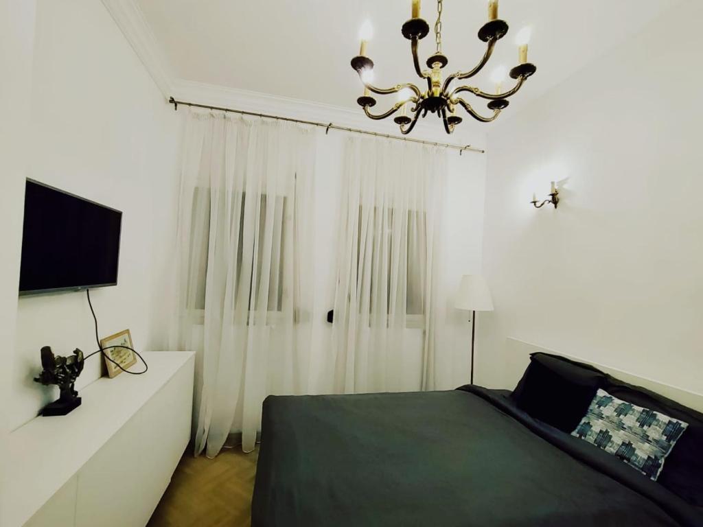 Ένα ή περισσότερα κρεβάτια σε δωμάτιο στο Eclectic Oasis