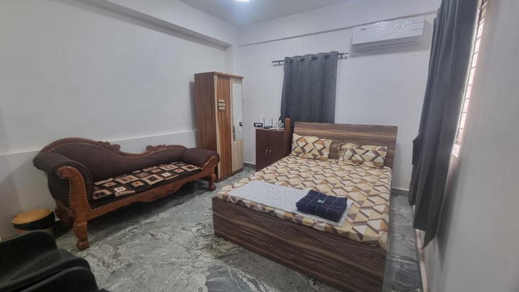 Postel nebo postele na pokoji v ubytování ShivSangit HomeStay
