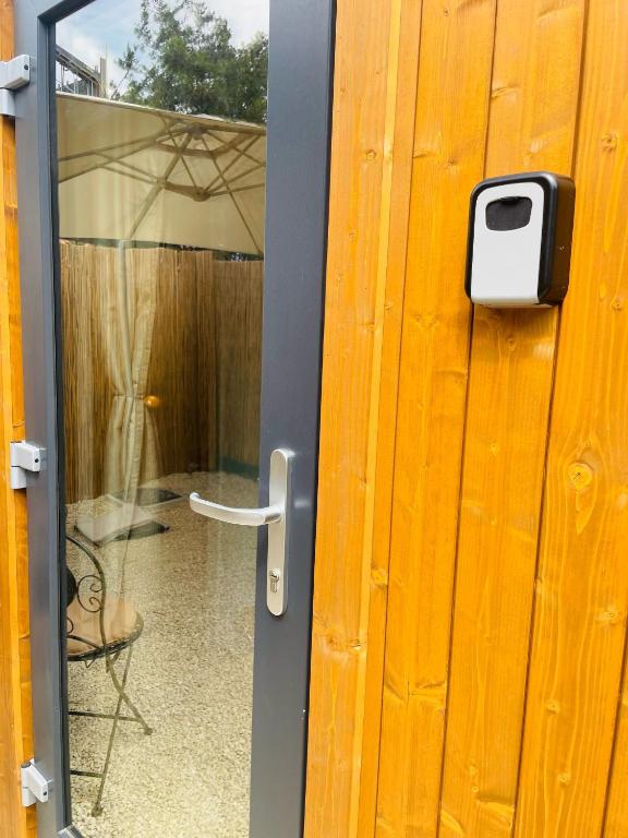 a door with a door handle and a window at Daro tiny house in Vama Veche
