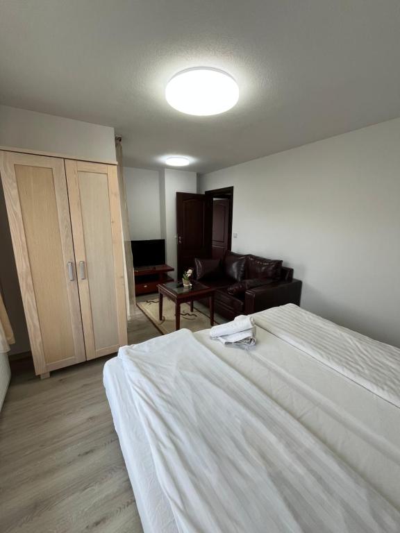 Postel nebo postele na pokoji v ubytování Bayrakova Guest House
