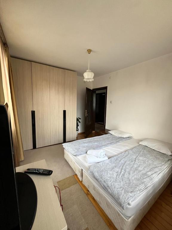 Postel nebo postele na pokoji v ubytování Bayrakova Guest House