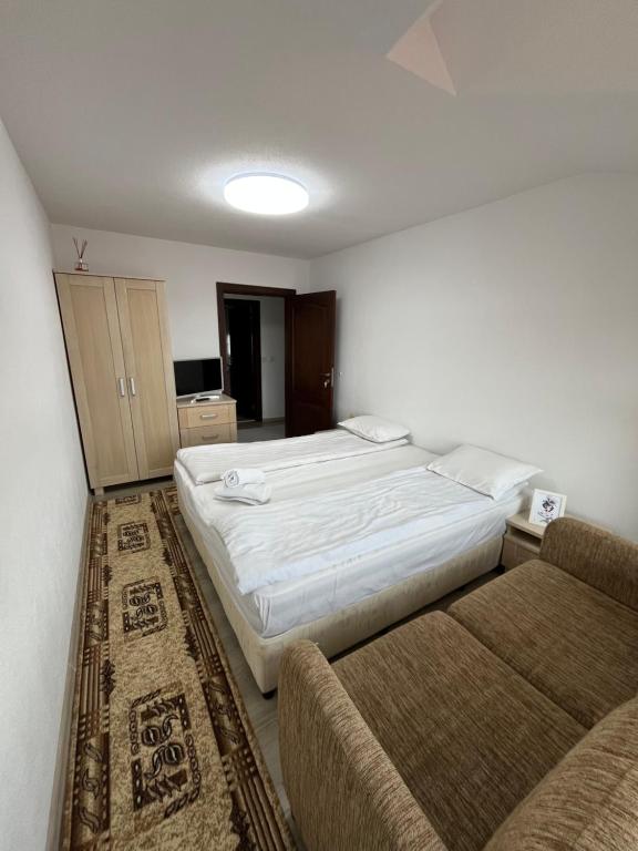 Postel nebo postele na pokoji v ubytování Bayrakova Guest House