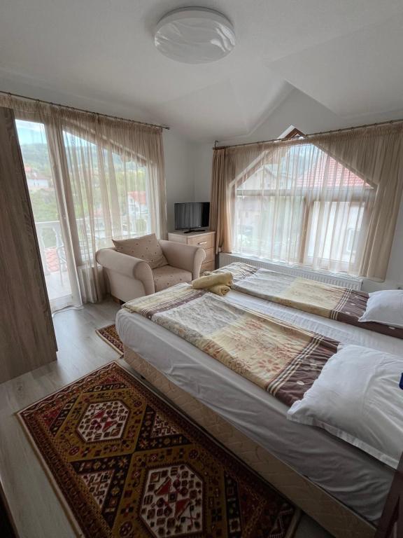 Postel nebo postele na pokoji v ubytování Bayrakova Guest House