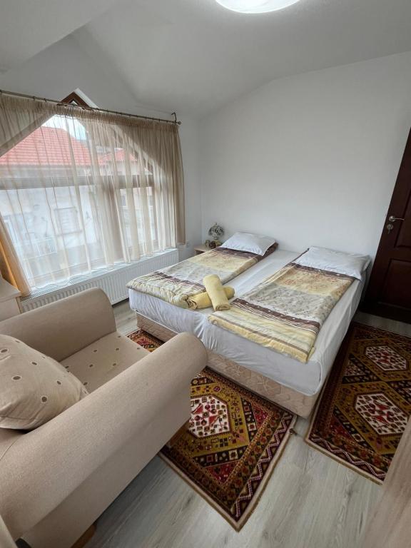 Postel nebo postele na pokoji v ubytování Bayrakova Guest House