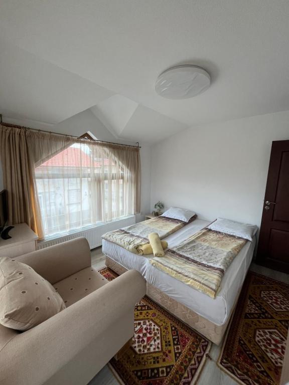 Postel nebo postele na pokoji v ubytování Bayrakova Guest House