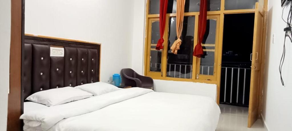 Postel nebo postele na pokoji v ubytování Sandeep homestay