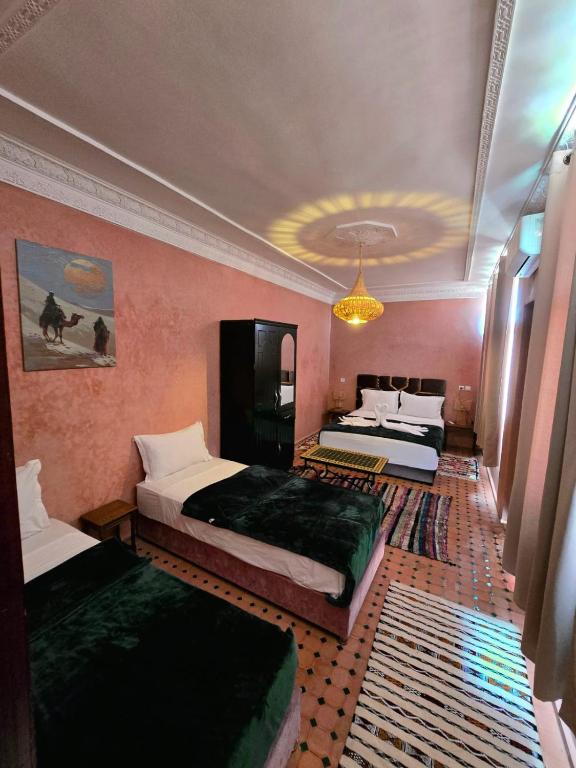 Postel nebo postele na pokoji v ubytování Riad Rime Garden Marrakech