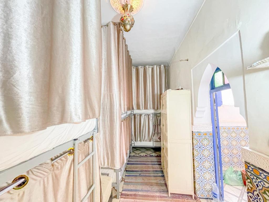 Postel nebo postele na pokoji v ubytování Sun Hostel