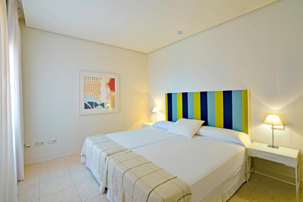 Posteľ alebo postele v izbe v ubytovaní Aparthotel Novo Resort