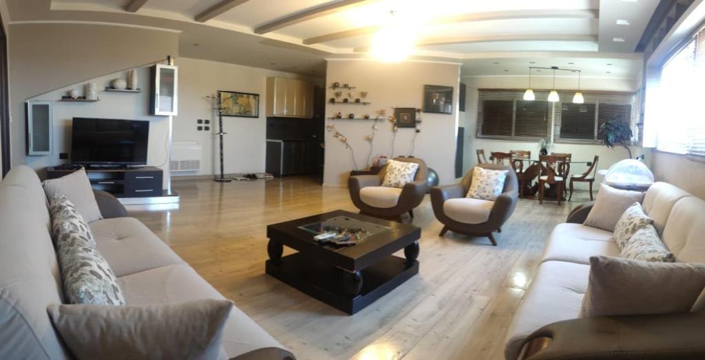 TV a/nebo společenská místnost v ubytování Andi guest house