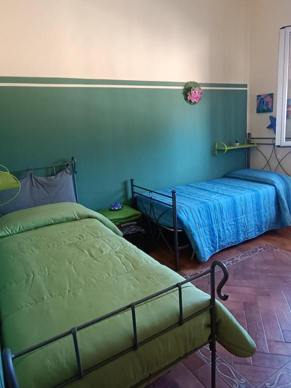Posteľ alebo postele v izbe v ubytovaní Casa Igiea