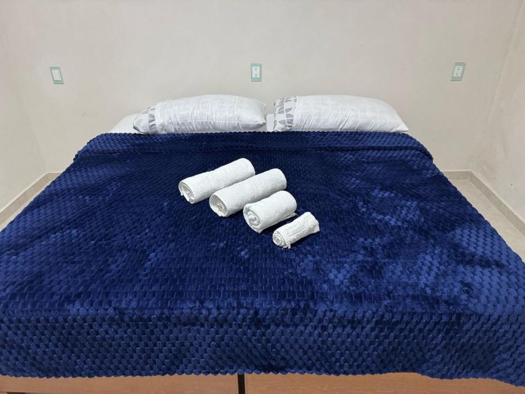 Postel nebo postele na pokoji v ubytování Hospedaje familiar Los Arcos