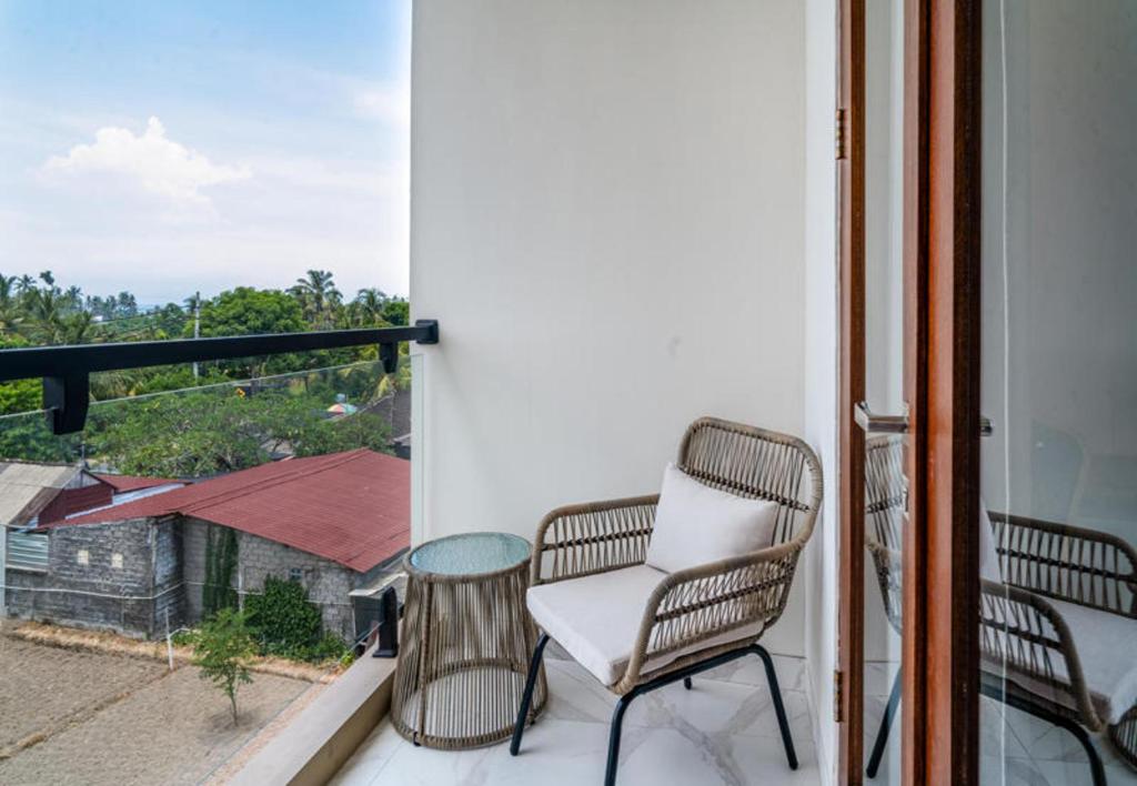 Balkón nebo terasa v ubytování Ayers Hotel&Resto