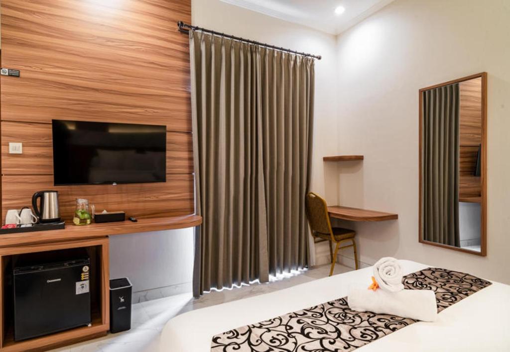 Kuchyň nebo kuchyňský kout v ubytování Ayers Hotel&Resto