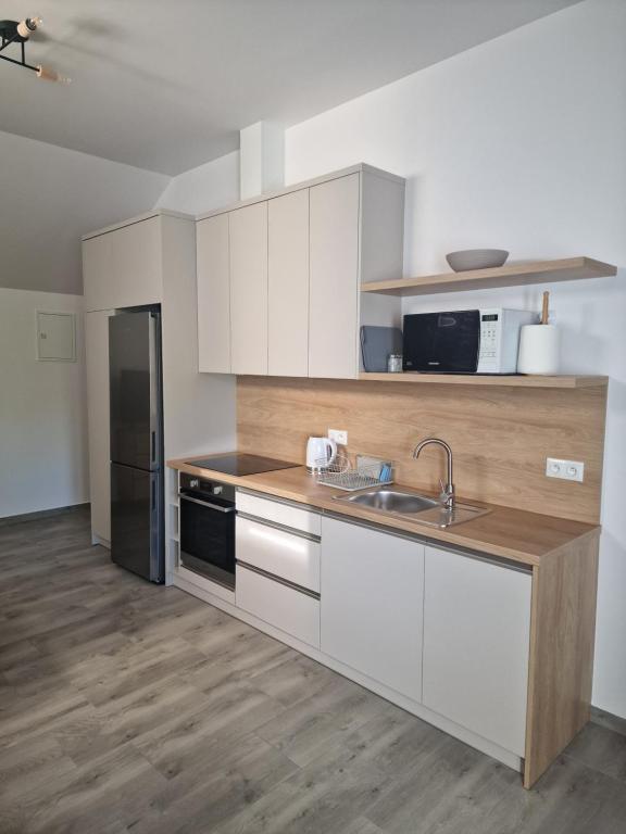 Kuchyňa alebo kuchynka v ubytovaní Apartamenty Mazury