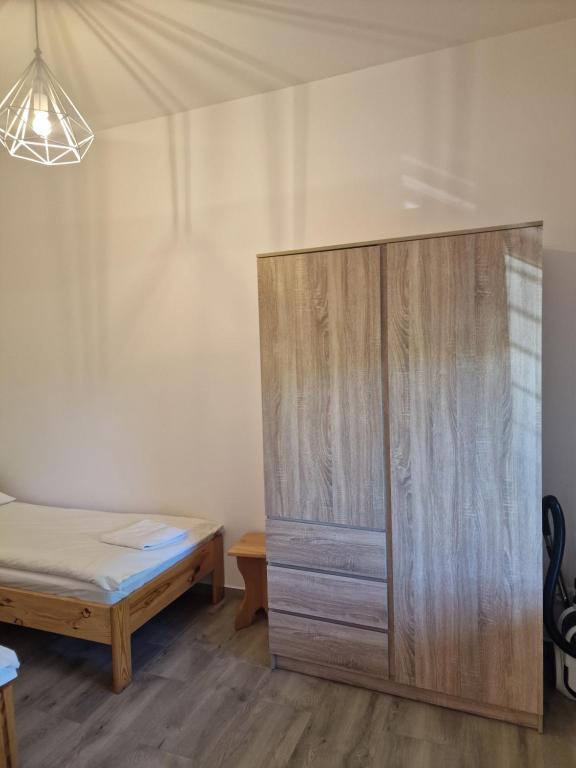 Posteľ alebo postele v izbe v ubytovaní Apartamenty Mazury